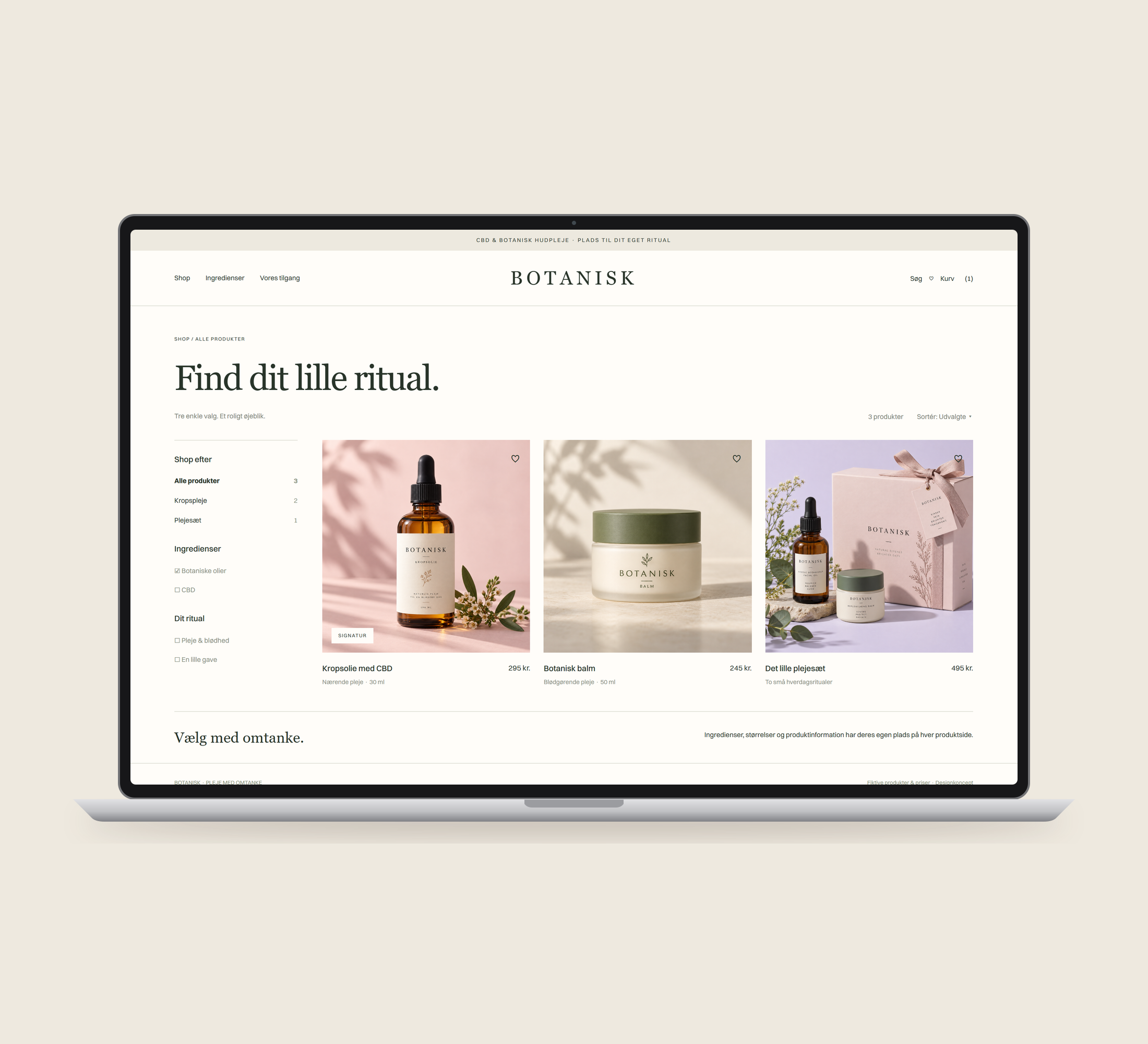 Botanisk: kollektion vist lige forfra på laptop på en ensfarvet studiobaggrund.