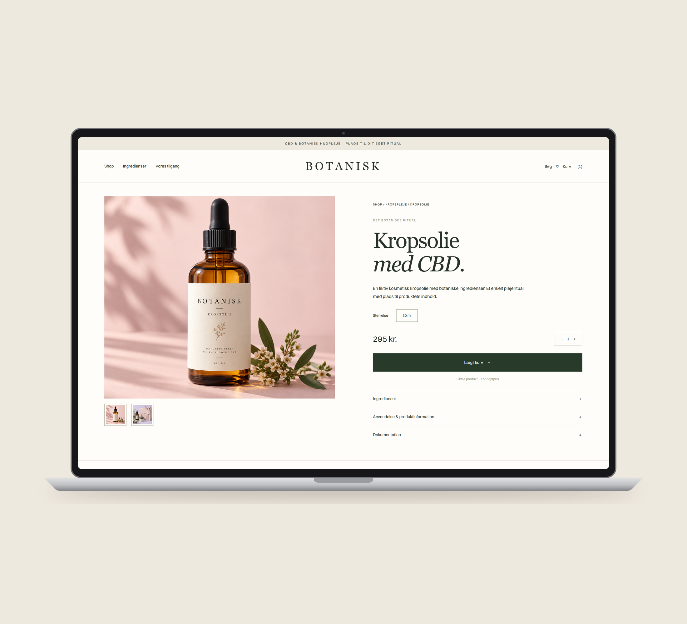 Botanisk: produkt vist lige forfra på laptop på en ensfarvet studiobaggrund.
