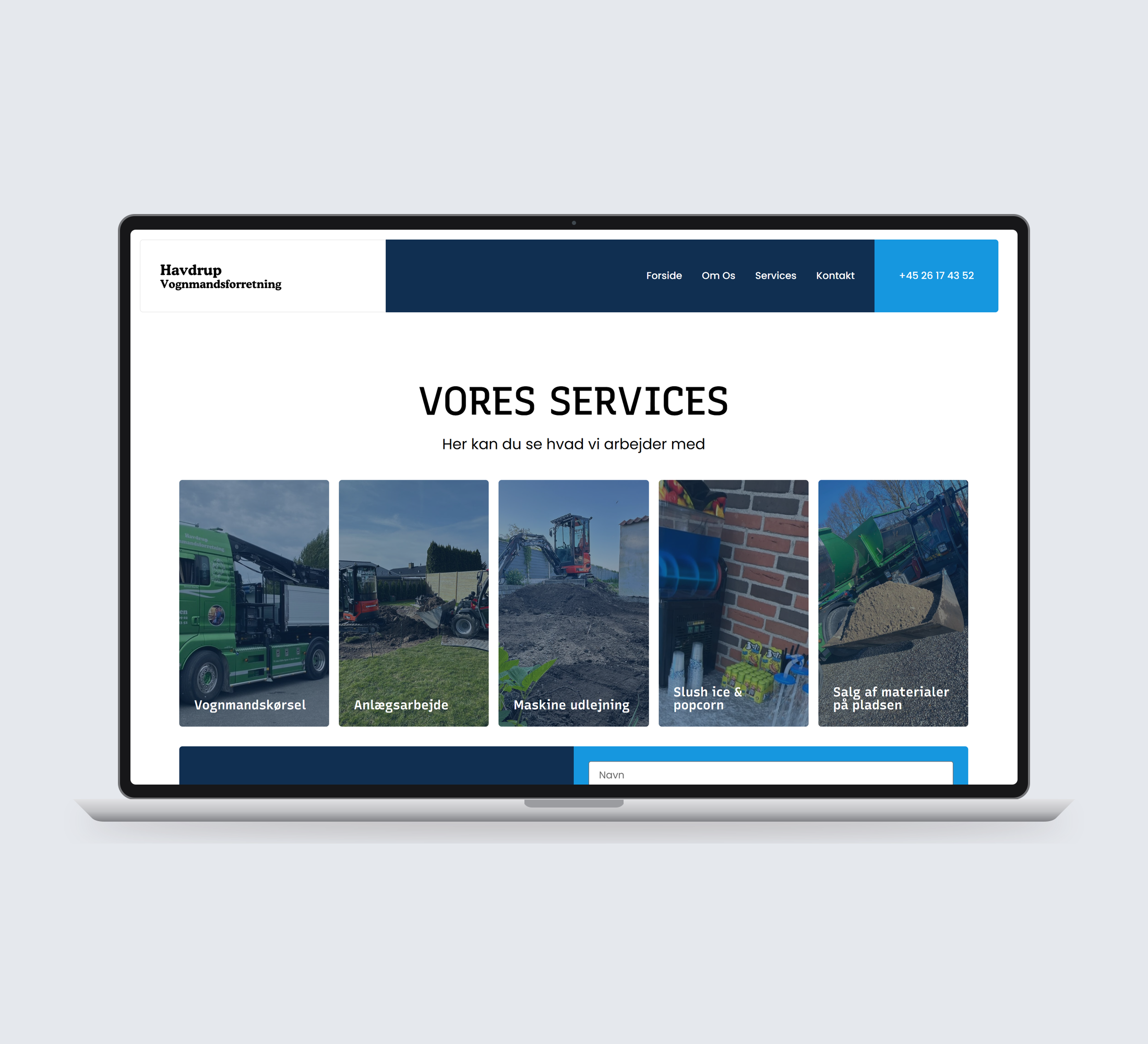 Havdrup Vognmandsforretning: services vist lige forfra på laptop på en ensfarvet studiobaggrund.