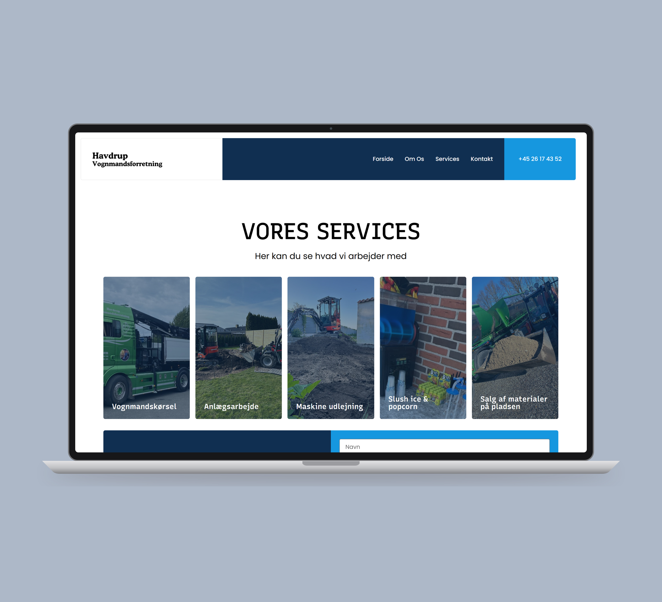 Havdrup Vognmandsforretning: services vist lige forfra på laptop på en ensfarvet studiobaggrund.
